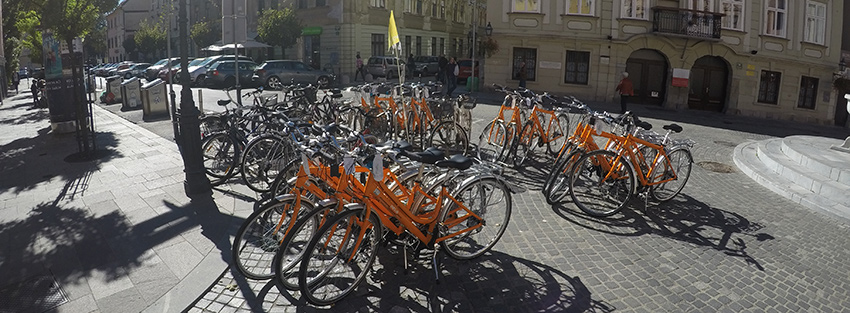 group of orange helia rental bikes in Ljubljana